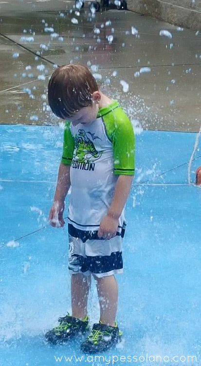 My son enjoying a day at the local splash pad.